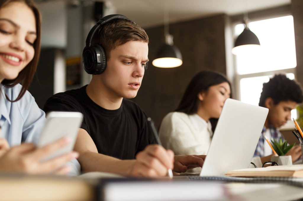 Group of students studying in university library